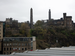 Calton Hill with the the Dugald Stewart Monument, the City Observatory, the National Monument of Scotland, the Nelson Monument, and the Old Calton Burial Ground with the Political Martyrs` Monument, viewed from North Bridge