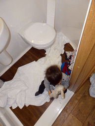 Max playing with toilet paper in the bathroom of our second apartment at the Richmond Place Apartments