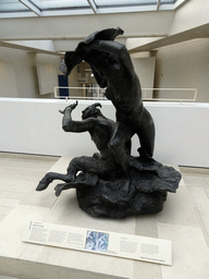 Statue `Nymph and Faun` by Charles Hodge Mackie, at the entrance to the Industry and Empire Hall at the Fifth Floor of the National Museum of Scotland, with explanation