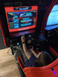 Max playing a racing game at the indoor playground at the Landal Coldenhove holiday park
