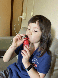 Max eating candy in the living room of our holiday home at the Landal Coldenhove holiday park