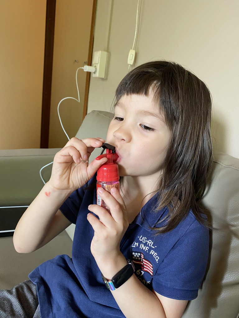 Max eating candy in the living room of our holiday home at the Landal Coldenhove holiday park