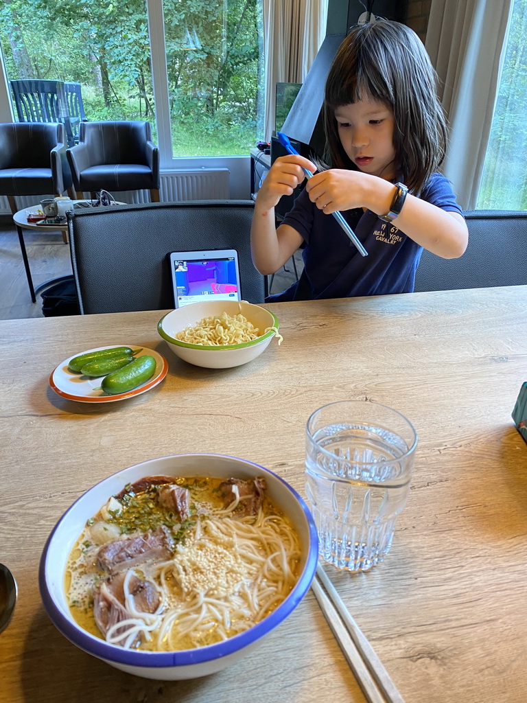 Max eating noodles in the living room of our holiday home at the Landal Coldenhove holiday park