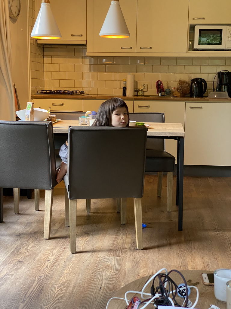 Max eating noodles in the living room of our holiday home at the Landal Coldenhove holiday park