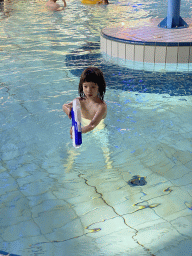 Max with a water gun in the swimming pool of the Landal Coldenhove holiday park
