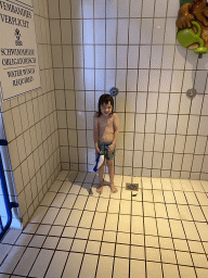 Max taking a shower at the swimming pool of the Landal Coldenhove holiday park