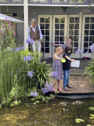 Max, his cousins and Tim`s father at the pond in the garden of the house of Tim`s father at Brummen