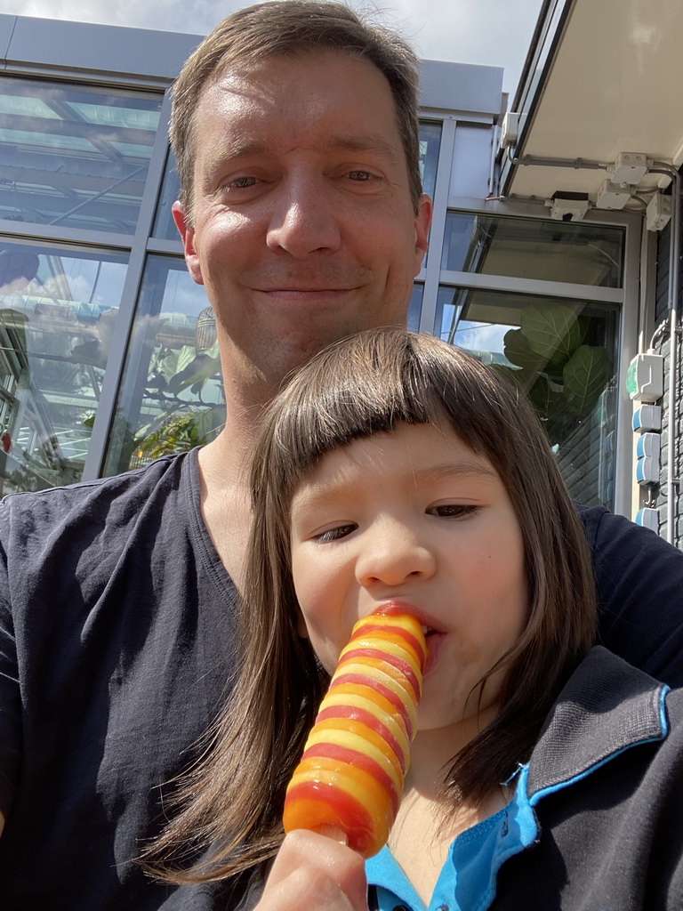 Tim and Max with an ice cream at the terrace of the Brasserie restaurant at the Landal Coldenhove holiday park