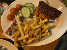 Steak with fries and vegetables at the Brasserie restaurant at the Landal Coldenhove holiday park