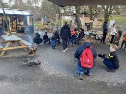 People cooking sausages above the campfire at the Landal Coldenhove holiday park