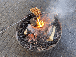 Max baking a waffle above the campfire at the Landal Coldenhove holiday park