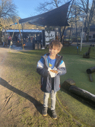 Max with his waffle in front of the campfire at the Landal Coldenhove holiday park