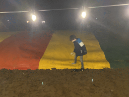 Max on the trampoline at the main playground at the Landal Coldenhove holiday park, by night