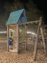 Max at the main playground at the Landal Coldenhove holiday park, by night