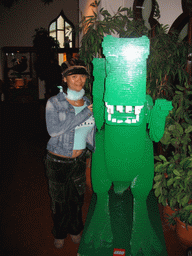 Miaomiao with a LEGO dinosaur statue at the LEGO exposition near the Fata Morgana attraction at the Anderrijk kingdom