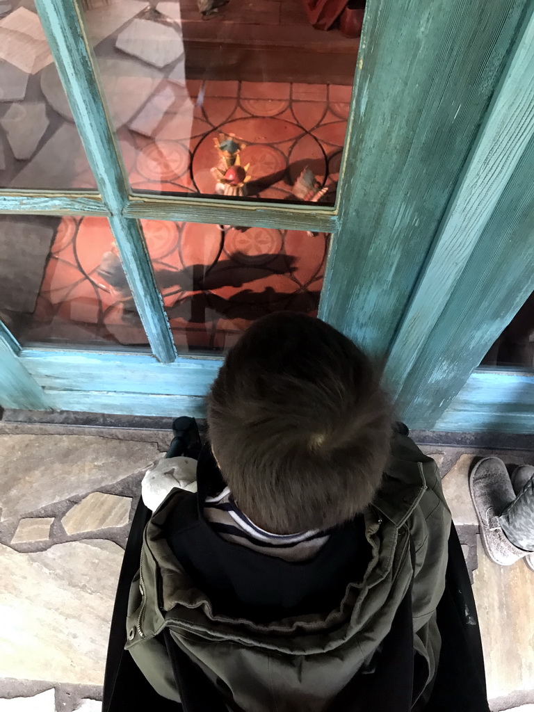 Max in front of Geppetto`s House at the Pinocchio attraction at the Fairytale Forest at the Marerijk kingdom