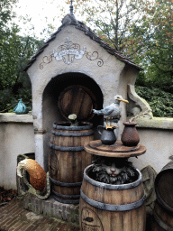 Wooden barrels, fox, cat and bird at the Pinocchio attraction at the Fairytale Forest at the Marerijk kingdom