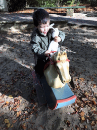 Max on the rocking horse at the Kindervreugd playground at the Marerijk kingdom