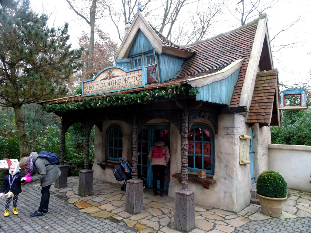 Max in front of Geppetto`s House at the Pinocchio attraction at the Fairytale Forest at the Marerijk kingdom, during the Winter Efteling