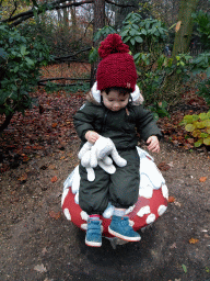 Max on a mushroom statue at the Fairytale Forest at the Marerijk kingdom, during the Winter Efteling