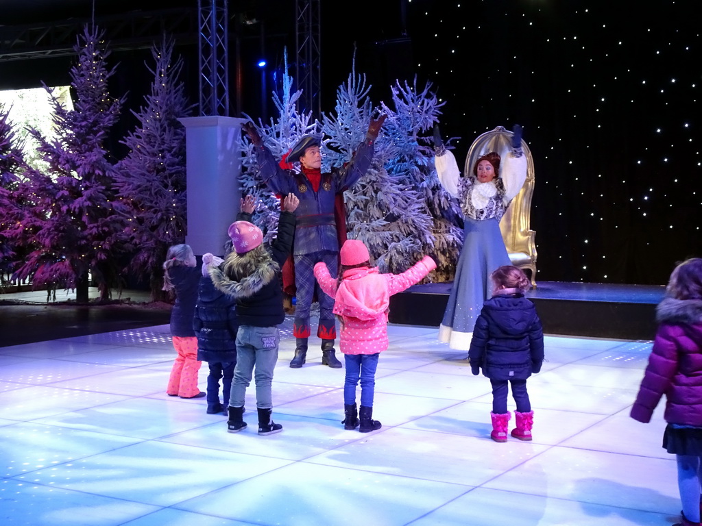 Actors and visitors during the `Fire Prince and Snow Princess` show at the IJspaleis attraction at the Reizenrijk kingdom, during the Winter Efteling