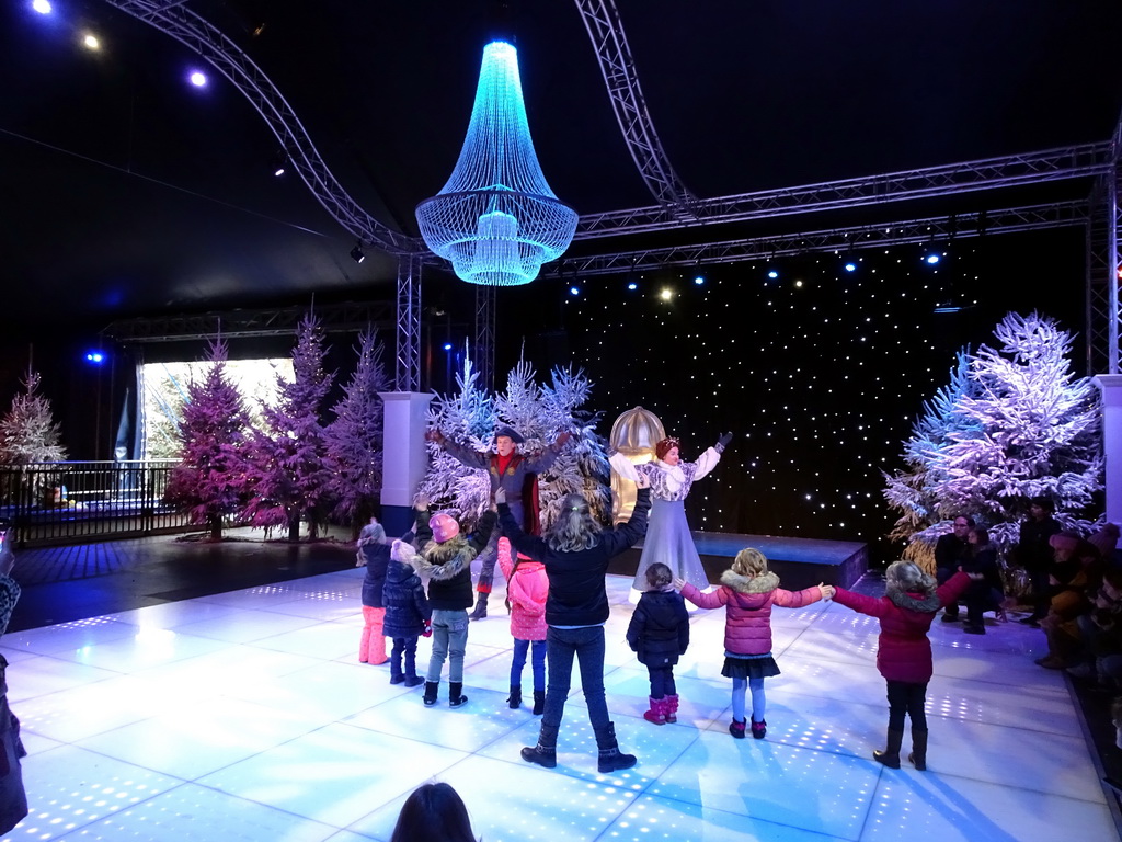 Actors and visitors during the `Fire Prince and Snow Princess` show at the IJspaleis attraction at the Reizenrijk kingdom, during the Winter Efteling