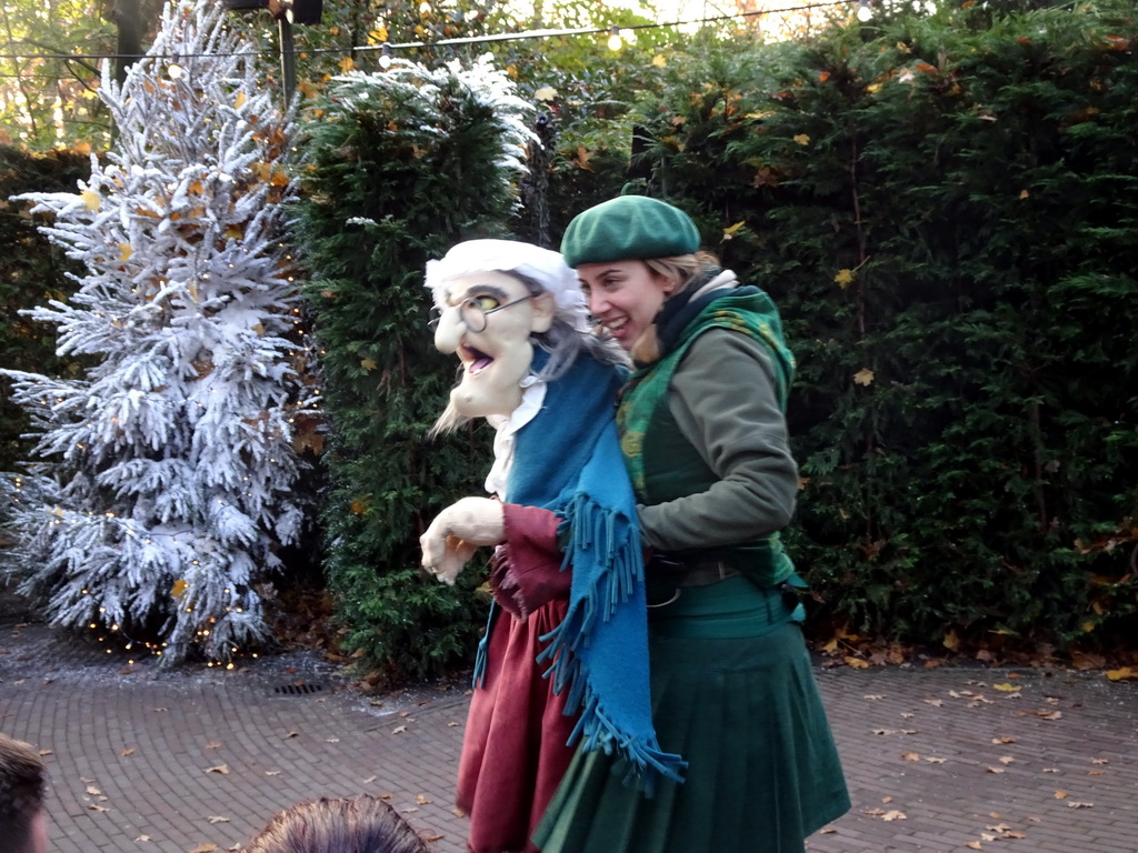 Actor with hand puppet during the Sprookjesboom Show at the Open-air Theatre at the Fairytale Forest at the Marerijk kingdom, during the Winter Efteling