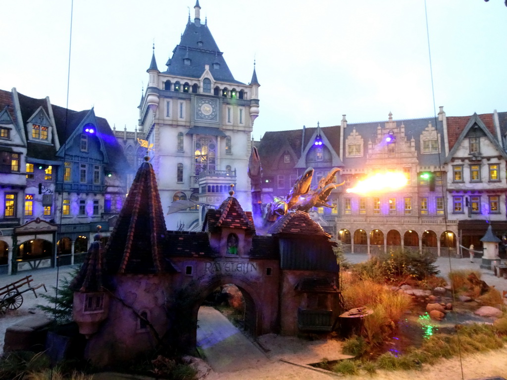 Dragon and fire on the stage of the Raveleijn theatre at the Marerijk kingdom, during the Raveleijn Parkshow at the Winter Efteling, at sunset