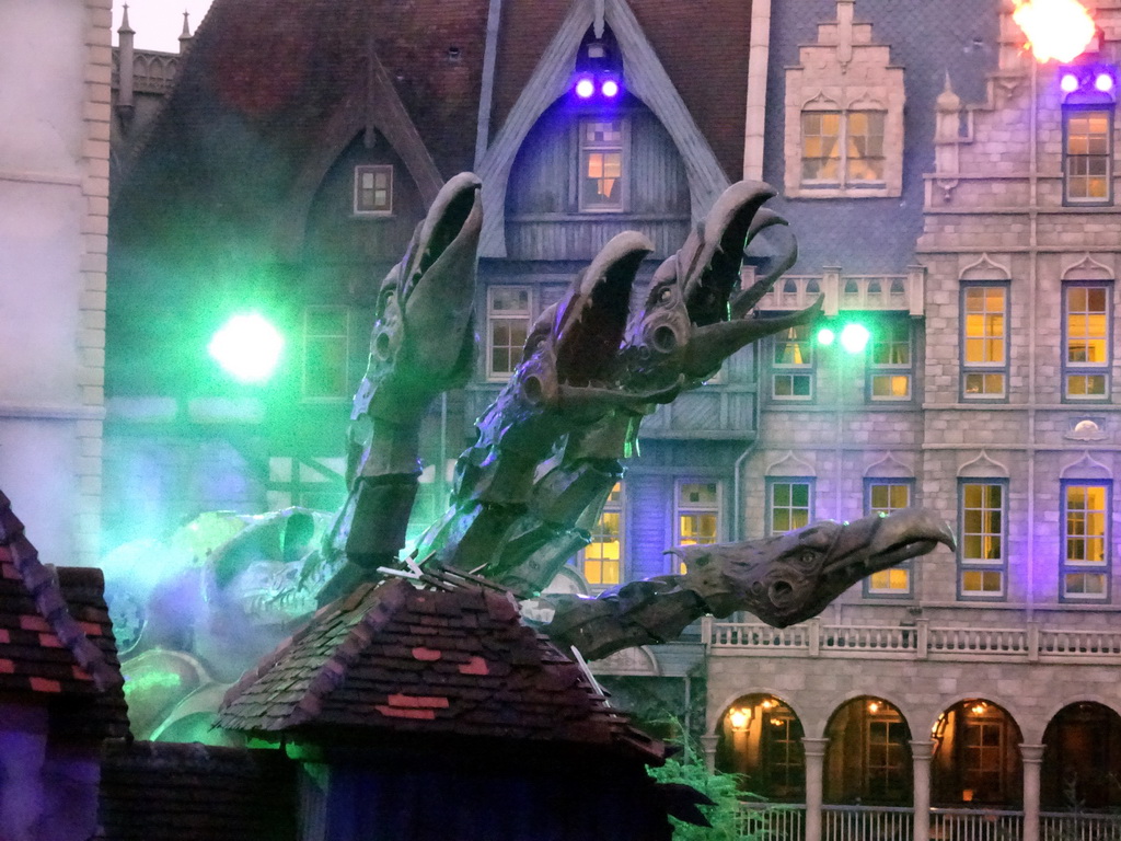 Dragon on the stage of the Raveleijn theatre at the Marerijk kingdom, during the Raveleijn Parkshow at the Winter Efteling, at sunset