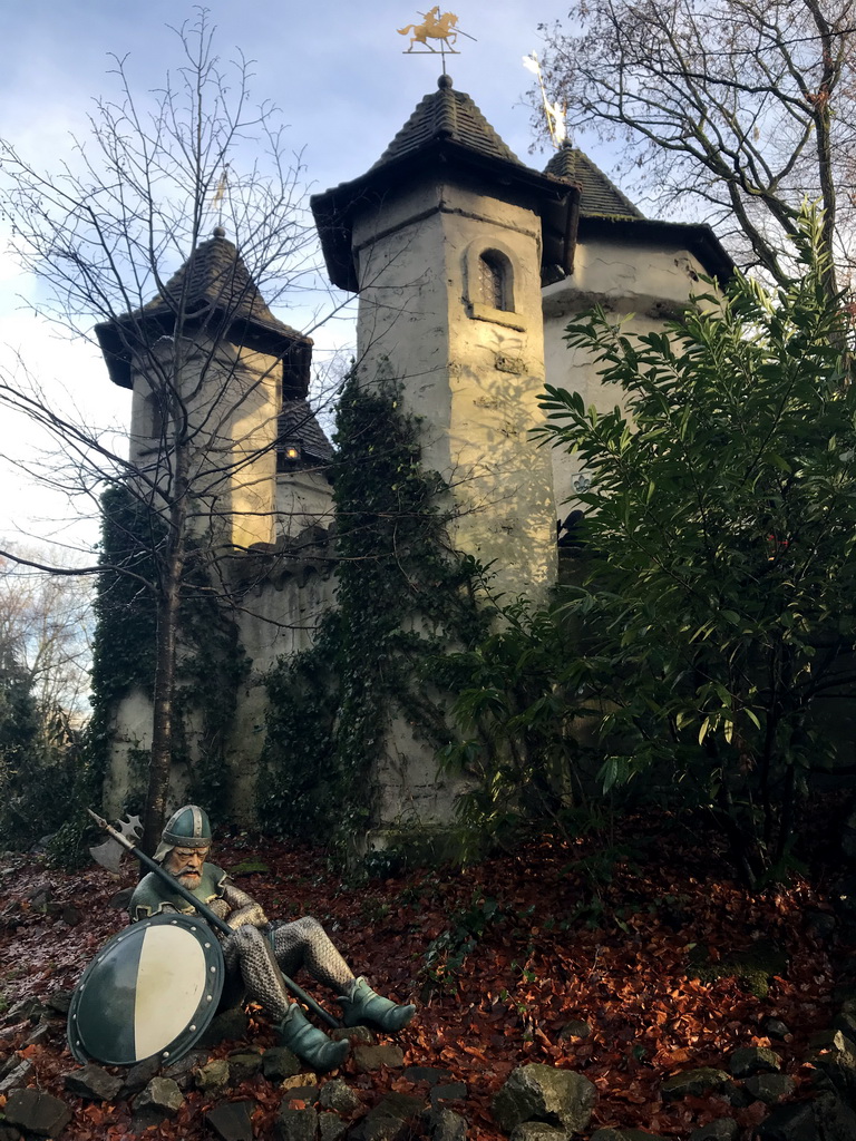 Sleeping guard in front of the Castle of Sleeping Beauty at the Sleeping Beauty attraction at the Fairytale Forest at the Marerijk kingdom, during the Winter Efteling