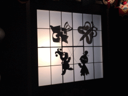 Shadow play at the Chinese scene at the Carnaval Festival attraction at the Reizenrijk kingdom, during the Winter Efteling