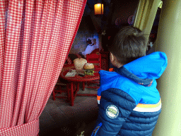 Max in front of the Big Bad Wolf at the Little Red Riding Hood attraction at the Fairytale Forest at the Marerijk kingdom, during the Winter Efteling