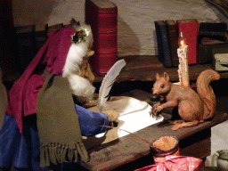 Gnome and squirrel in a house at the Gnome Village attraction at the Fairytale Forest at the Marerijk kingdom, during the Winter Efteling