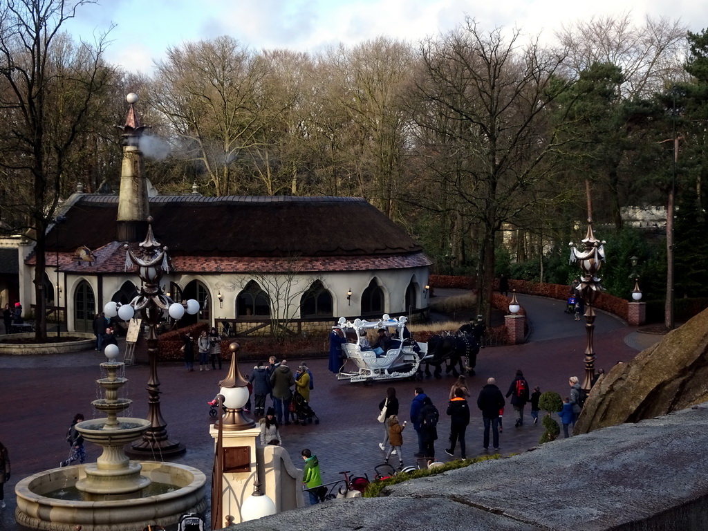 Horses and carriage in front of the Polles Keuken restaurant at the Fantasierijk kingdom, viewed from the queue to the Symbolica attraction, during the Winter Efteling