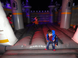 Max on the trampoline at the IJspaleis attraction at the Reizenrijk kingdom, during the Winter Efteling