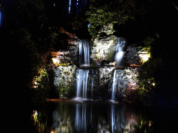 Waterfall at the Gondoletta lake at the Reizenrijk kingdom, during the Winter Efteling, by night