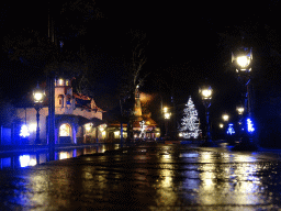The Pardoes Promenade with the statue of Pardoes, the Polles Keuken restaurant and a christmas tree at the Fantasierijk kingdom, during the Winter Efteling, by night