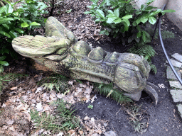 Wooden dragon head statue next to Geppetto`s House at the Pinocchio attraction at the Fairytale Forest at the Marerijk kingdom
