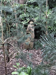 Wooden statue next to Geppetto`s House at the Pinocchio attraction at the Fairytale Forest at the Marerijk kingdom
