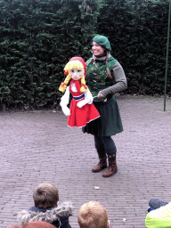 Actor with hand puppet during the Sprookjesboom Show at the Open-air Theatre at the Fairytale Forest at the Marerijk kingdom