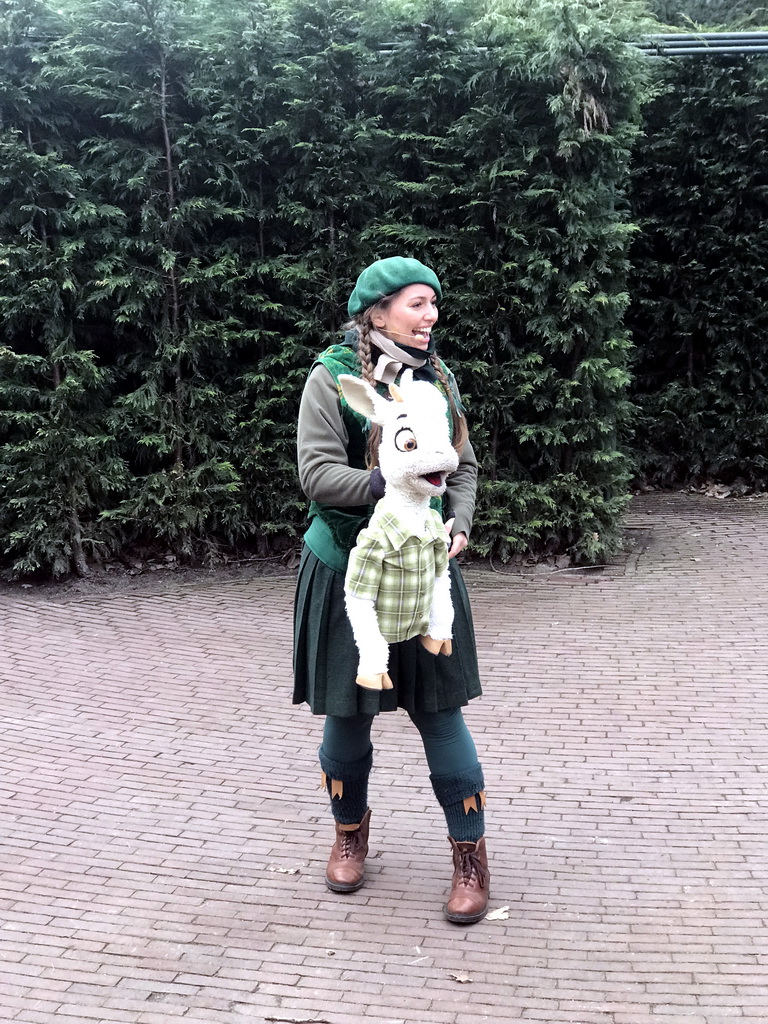 Actor with hand puppet during the Sprookjesboom Show at the Open-air Theatre at the Fairytale Forest at the Marerijk kingdom