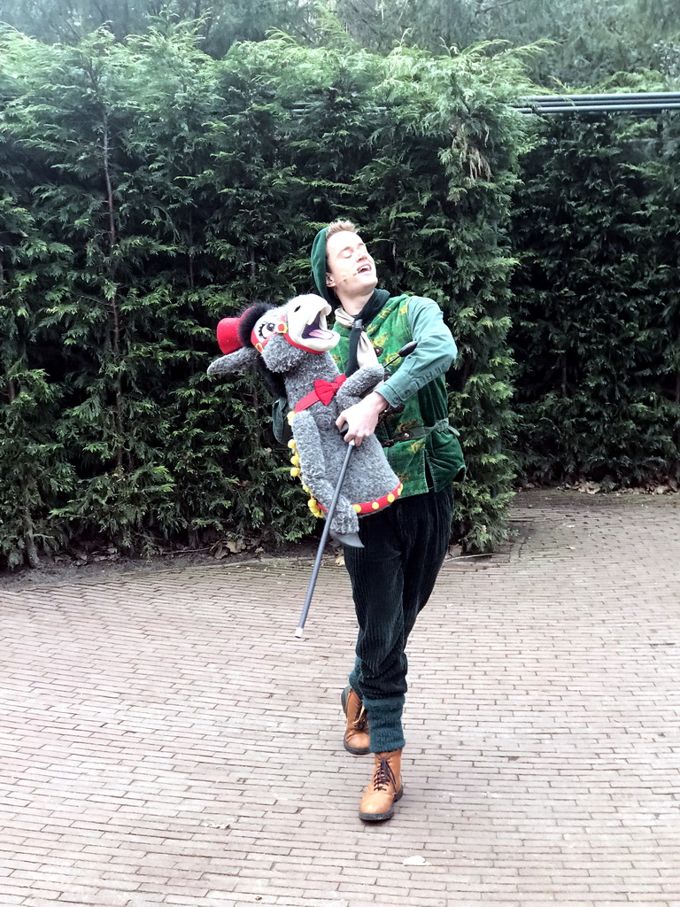 Actor with hand puppet during the Sprookjesboom Show at the Open-air Theatre at the Fairytale Forest at the Marerijk kingdom