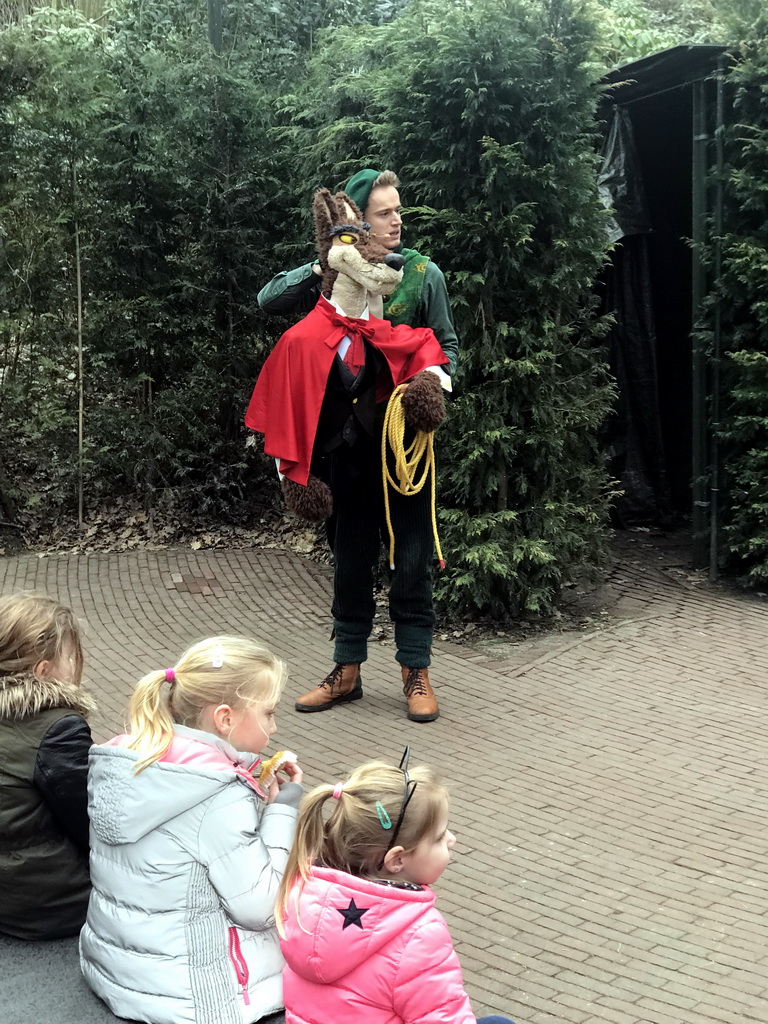 Actor with hand puppet during the Sprookjesboom Show at the Open-air Theatre at the Fairytale Forest at the Marerijk kingdom