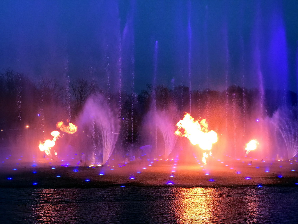 The Aquanura lake and fire at the Fantasierijk kingdom, during the water show, at sunset