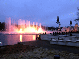 The Aquanura lake at the Fantasierijk kingdom and the Fata Morgana attraction at the Anderrijk kingdom, during the water show, at sunset