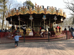 Max in front of the Vermolen Carousel at the Anton Pieck Plein square at the Marerijk kingdom