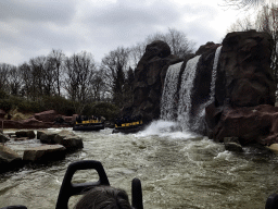 Waterfall and boats at the Piraña attraction at the Anderrijk kingdom, viewed from a boat