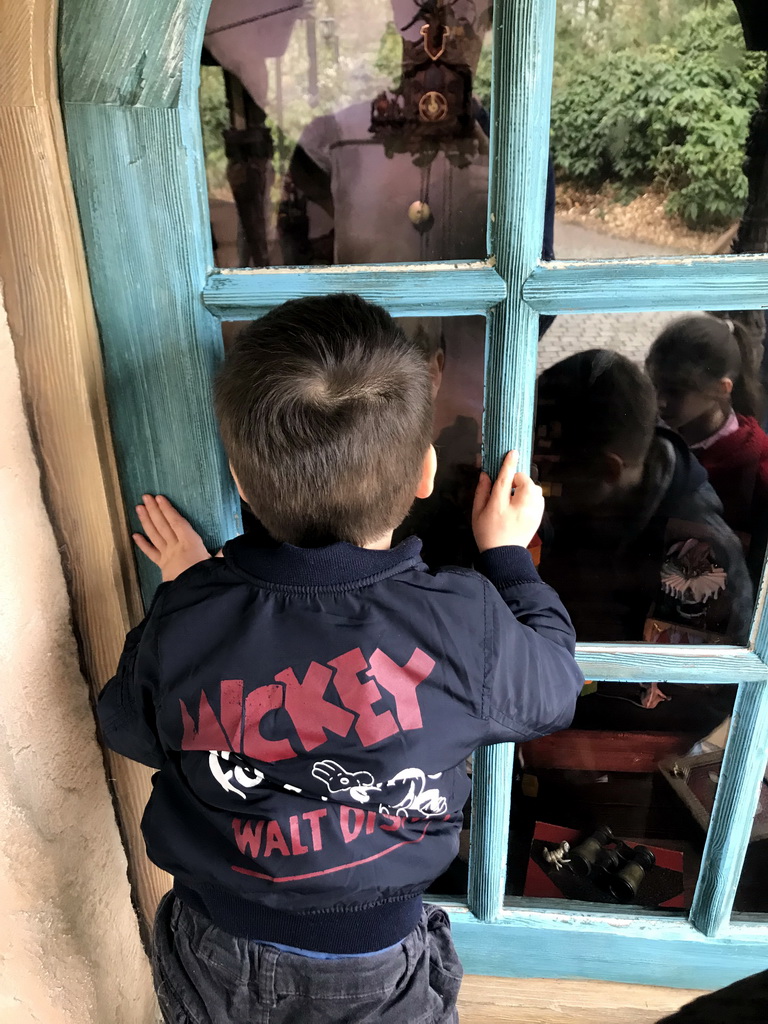 Max in front of Geppetto`s House at the Pinocchio attraction at the Fairytale Forest at the Marerijk kingdom