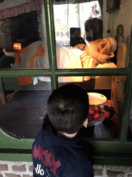 Max with a sleeping gnome at the Gnome Village attraction at the Fairytale Forest at the Marerijk kingdom