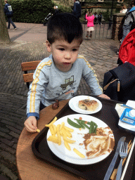 Max having lunch at the Anton Pieck Plein square at the Marerijk kingdom